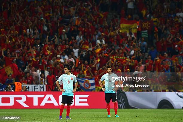 Hakan Balta and Selcuk Inan of Turkey look dejected during the UEFA EURO 2016 Group D match between Spain and Turkey at Allianz Riviera Stadium on...