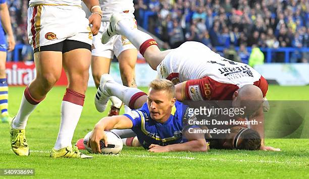 Brad Dwyer of Warrington Wolves scores his sides 3rd try during the First Utility Super League Round 19 match between Warrington Wolves and Catalans...