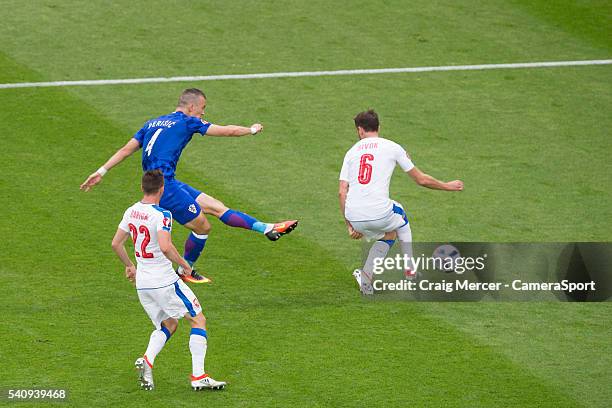 Croatia's Ivan Perisic scores the opening goal despite the attentions of Czech Republic's Tomas Sivok during the UEFA Euro 2016 Group D match between...