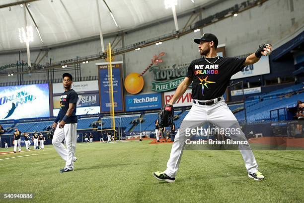Kevin Kiermaier, right, of the Tampa Bay Rays, and teammate Desmond Jennings wears We Are Orlando t-shirts during warm ups in honor of the victims of...
