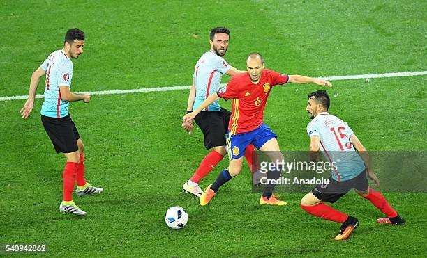 Andres Iniesta of Spain in action against Gokhan Gonul of Turkey during the UEFA Euro 2016 Group D football match between Spain and Turkey, at...
