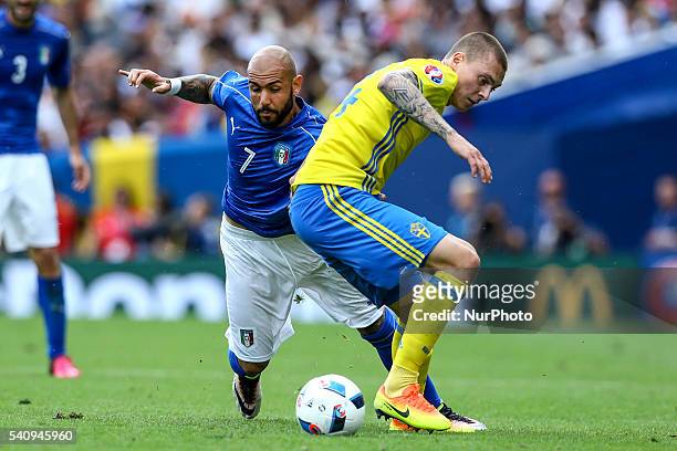 Simone Zaza of Italy is challenged by Victor Nilsson Lindelof of Sweeden during the UEFA EURO 2016 Group E match between Italy and Sweden at Stadium...