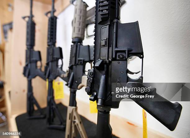 Semi-automatic guns are on display for sale at Action Target on June 17, 2016 in Springville, Utah. Semi-automatics are in the news again after the...