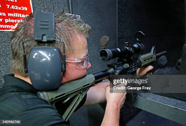 David Barker test fires an AR-15 semi-automatic gun at Action Target on June 17, 2016 in Springville, Utah. Semi-automatics are in the news again...