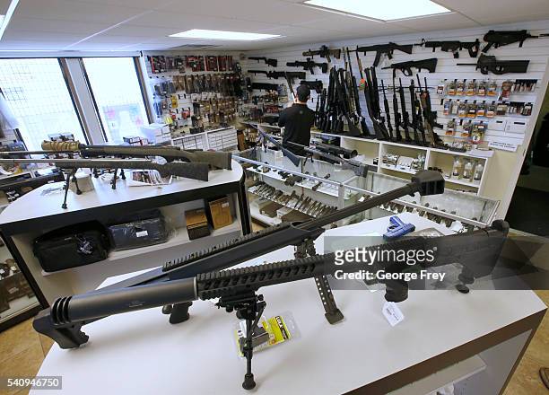 Many guns including AR-15's sit on display ready for sale at Ready Gunman on June 17, 2016 in Springville, Utah. Semi-automatics are in the news...