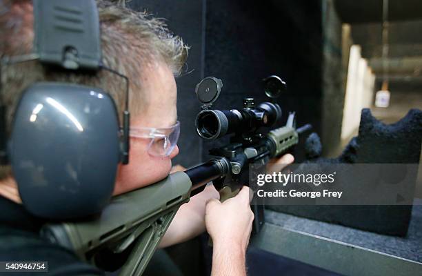 David Barker test fires an AR-15 semi-automatic gun at Action Target on June 17, 2016 in Springville, Utah. Semi-automatics are in the news again...