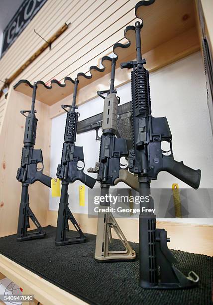 Semi-automatic guns are on display for sale at Action Target on June 17, 2016 in Springville, Utah. Semi-automatics are in the news again after the...