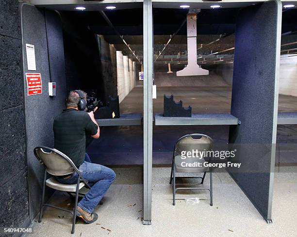 David Barker test fires an AR-15 semi-automatic gun at Action Target on June 17, 2016 in Springville, Utah. Semi-automatics are in the news again...