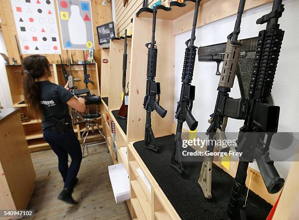 Courtney Manwaring puts away an AR-15 semi-automatic gun at Action Target on June 17, 2016 in Springville, Utah. Semi-automatics are in the news...