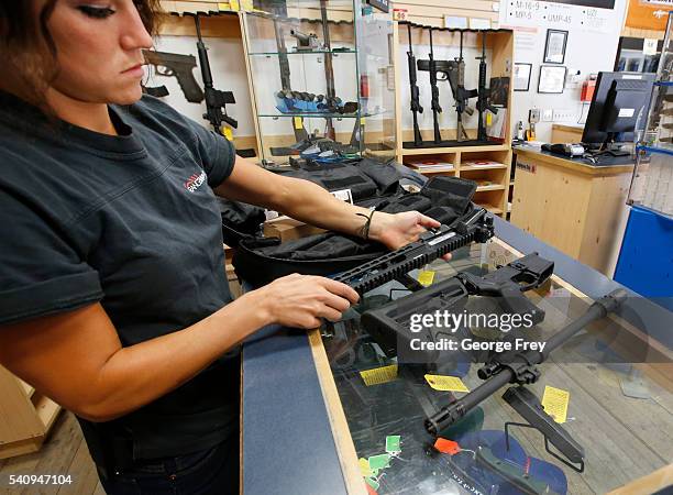 Courtney Manwaring unpacks an AR-15 semi-automatic gun kit at Action Target on June 17, 2016 in Springville, Utah. Semi-automatics are in the news...