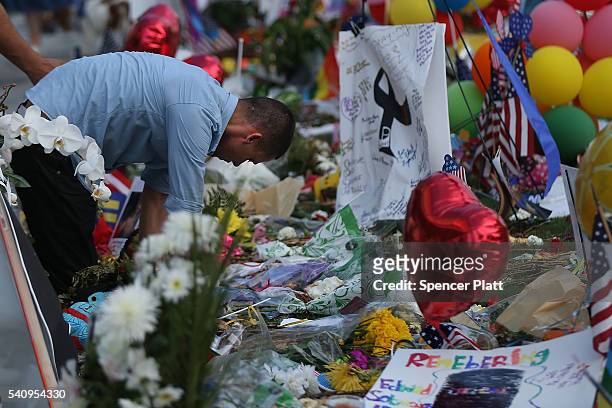 Man grieves for a friend at a memorial at the Performing Arts Center which is down the road from the Pulse nightclub on June 17, 2016 in Orlando,...