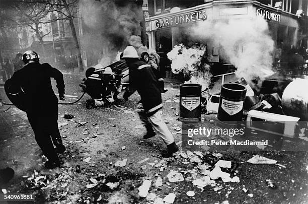 Car fuel tank explodes on the Charing Cross Road, during the Poll Tax Riots in London, 31st March 1990.