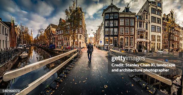 walking into amsterdam - amsterdam bridge stock pictures, royalty-free photos & images