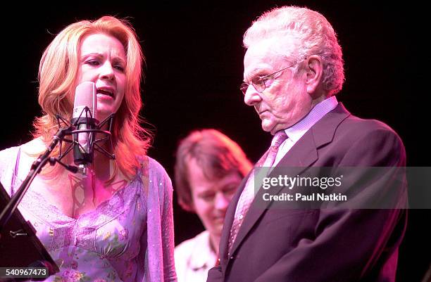 American country musicians Patty Loveless and Ralph Stanley perform together onstage, Chicago, Illinois, July 22, 2002.