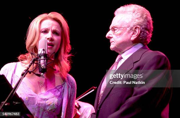 American country musicians Patty Loveless and Ralph Stanley perform together onstage, Chicago, Illinois, July 22, 2002.