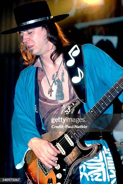 American musician Stevie Ray Vaughan plays guitar as he performs onstage at the Fireside Bowl, Chicago, Illinois, February 17, 1984.