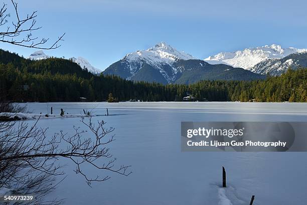 lake levette and tantalus range in winter - tantalus monkey stock pictures, royalty-free photos & images