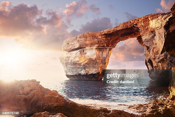 azure window in sunset, malta - stone arch stock pictures, royalty-free photos & images