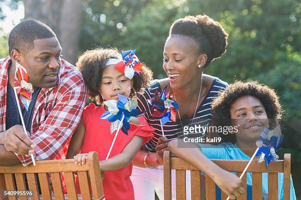 family celebrating memorial day or july 4th - war memorial holiday stock pictures, royalty-free photos & images