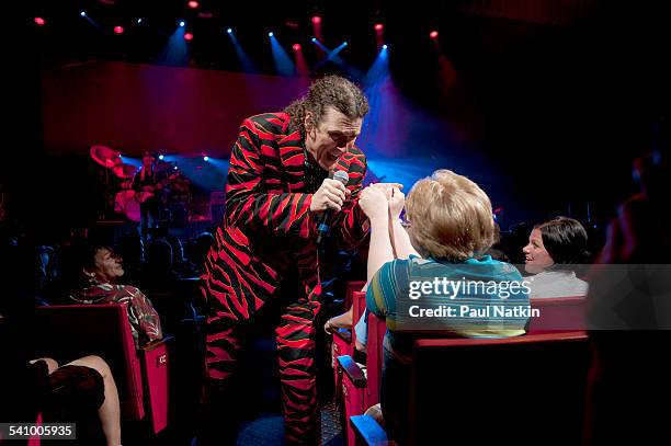 American musician and comedian Weird Al Yankovic, in a tiger-striped suit, interacts with the audience as he performs at the Star Plaza Theater,...