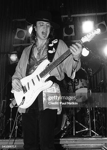 American musician Stevie Ray Vaughan plays guitar as he performs onstage at the Fireside Bowl, Chicago, Illinois, February 17, 1984.