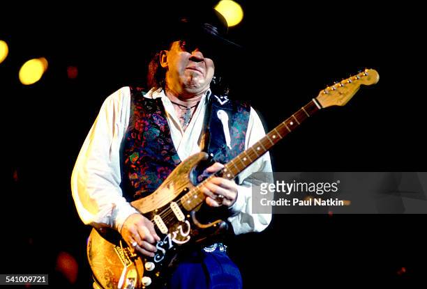 American musician Stevie Ray Vaughan plays guitar as he performs onstage at the Alpine Valley Music Theater, East Troy, Wisconsin, August 25, 1990.