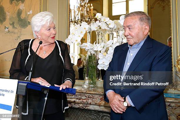 Line Renaud hands the Insignia of "Commandeur de l'Ordre National du Merite" to Levon Sayan at Hotel d'Evreux on June 14, 2016 in Paris, France.