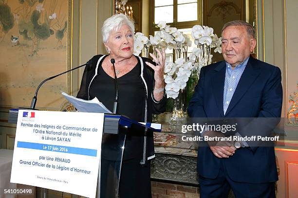 Line Renaud hands the Insignia of "Commandeur de l'Ordre National du Merite" to Levon Sayan at Hotel d'Evreux on June 14, 2016 in Paris, France.