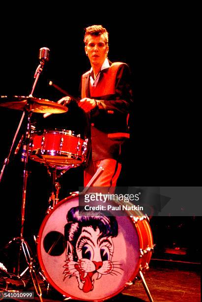 American musician Slim Jim Phantom , of the band the Stray Cats, plays drums as he performs onstage, Chicago, Illinois, October 28, 1983.