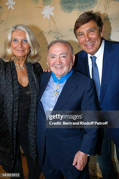 Levon Sayan standing between Jean-Pierre Foucault and his wife Evelyn Jarre attend Levon Sayan receives Insignia of "Commandeur de l'Ordre National...