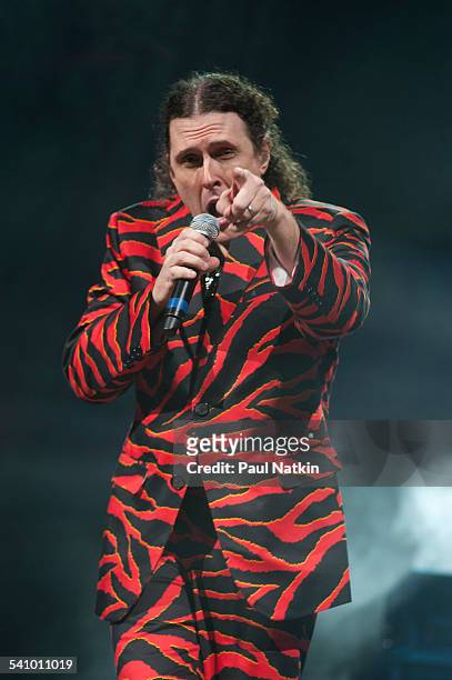 American musician and comedian Weird Al Yankovic, in a tiger-striped suit, performs onstage at the Star Plaza Theater, Merrillville, Indiana, July 9,...