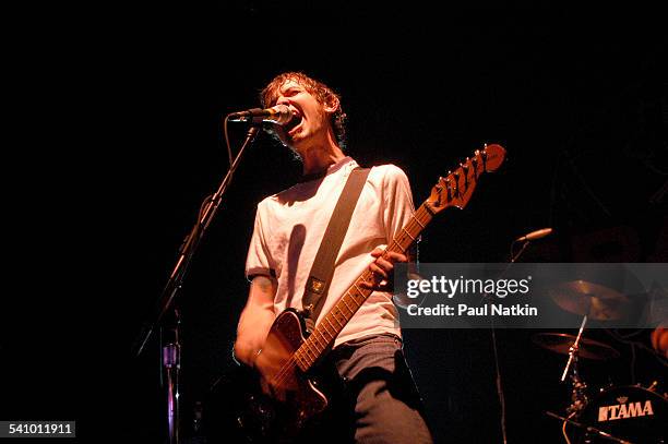 American musician Jim Ward, of the rock band Sparta, plays guitar as he performs onstage, Chicago, Illinois, March 10, 2003.