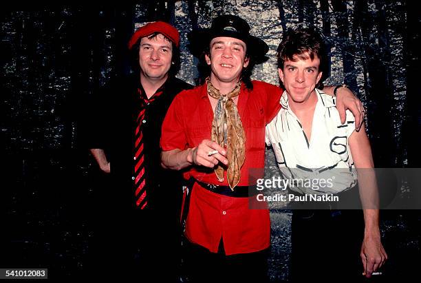 Portrait of American musician Stevie Ray Vaughan and his band as they pose backstage at the Metro, Chicago, Illinois, July 3, 1983.