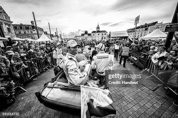 In this handout image provided by Red Bull, #1 Porsche LMP1 driver Mark Webber of Australia during the Drivers Parade on the eve of the 24 Hours of...