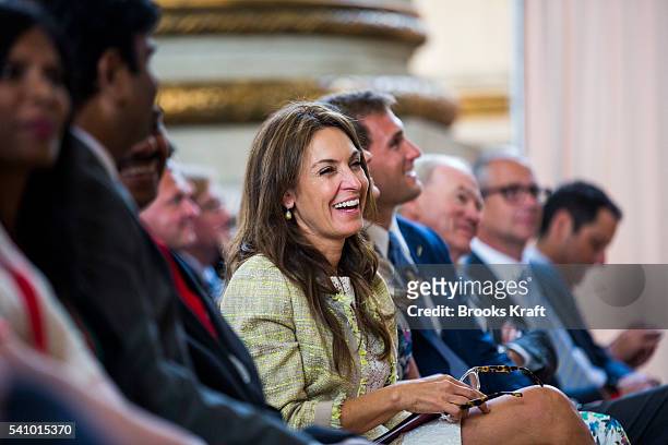 Suzy Welch listens to her husband former General Electric CEO Jack Welch speak at a ceremony, June 11, 2016 in Washington, DC. She is an author,...