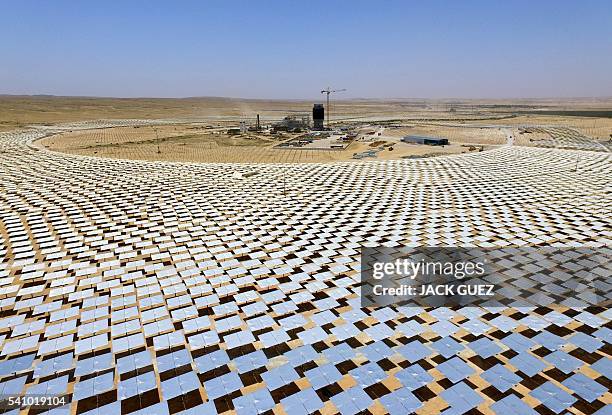 Picture taken on May 26 shows some of the 55,000 mirrors directing sunlight toward the Ashalim solar tower which is under construction near the...