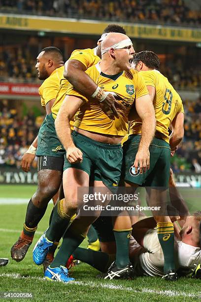 Wallabies captain Stephen Moore celebrates scoring a try during the International Test match between the Australian Wallabies and England at AAMI...