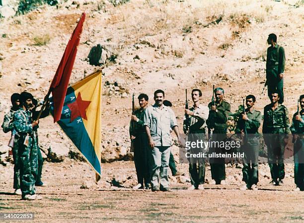 Abdullah Öcalan, leader of the PKK, reviews his armed guerilla fighters