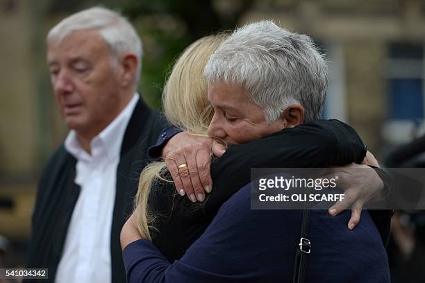 Kim Leadbeater , the sister of murdered Labour MP Jo Cox, hugs her mother Jean Leadbeater as her father Gordon Leadbeater views the floral tributes...