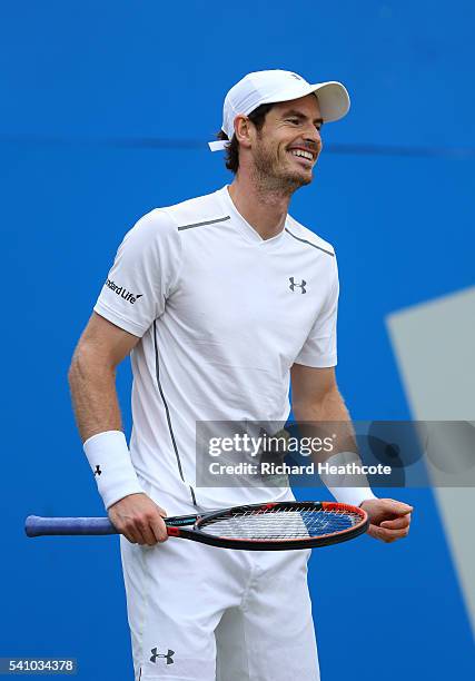 Andy Murray of Great Britain smiles and laughs as he reacts to a point during his semi final match against Maric Cilic of Croatia on day six of the...