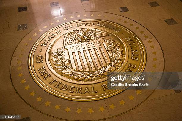 Gold plated seal outside inside the Eccles Building, the place of the Board of Governors of the Federal Reserve System and of the Federal Open Market...