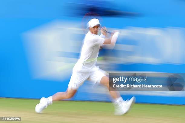 Andy Murray of Great Britain hits a backhand return during his semi final match against Maric Cilic of Croatia on day six of the Aegon Championships...