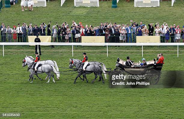 Queen Elizabeth II and Prince Philip, Duke of Edinburgh arrive in the Royal Procession on day 5 of Royal Ascot at Ascot Racecourse on June 18, 2016...