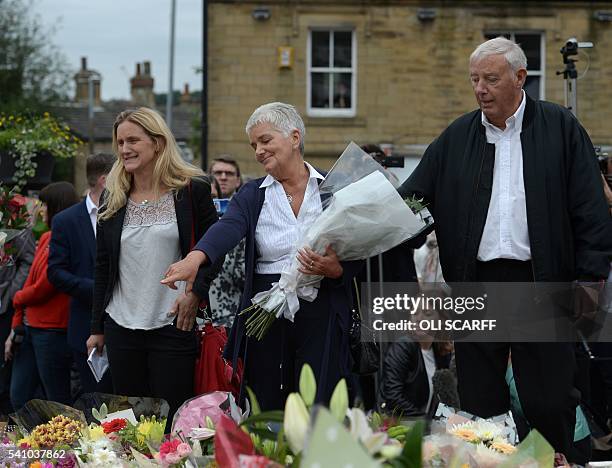 Jean and Gordon Leadbeater , the parents of murdered Labour MP Jo Cox, and Kim Leadbeater , Jo's sister, view the floral tributes left to Jo near to...