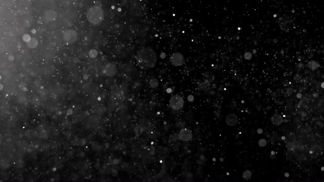 Dust Particles shot on black.