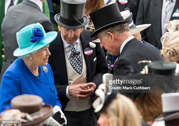 Queen Elizabeth II talks to Prince Charles, Prince of Wales after her horse Dartmouth won on day 5 of Royal Ascot at Ascot Racecourse on June 18,...