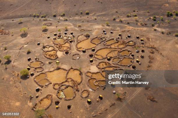 aerial view of rendille village huts and livestock pens.kenya - thatched roof huts stock pictures, royalty-free photos & images