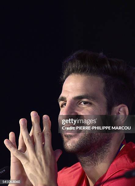 Spain's midfielder Cesc Fabregas smiles during a press conference at Saint Martin de Re's stadium on June 18 during the Euro 2016 football...