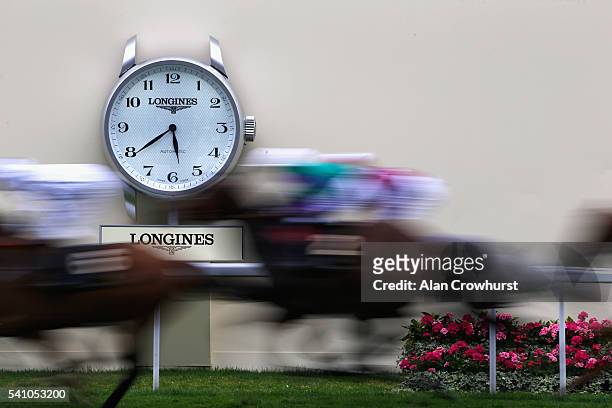 General view of the action and the Longines clock on day 5 of Royal Ascot at Ascot Racecourse on June 18, 2016 in Ascot, England.