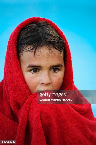 wet boy in red towel - terry cloth stock pictures, royalty-free photos & images